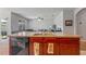 Kitchen view showcases a breakfast bar area with stainless steel dishwasher and sink at 1918 Marabou Dr, Davenport, FL 33896