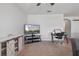 Spacious living area featuring modern media center, and a dedicated desk area with computer at 1918 Marabou Dr, Davenport, FL 33896