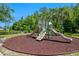 Community playground with slides and climbing wall over a wood chip base, perfect for  at 1918 Marabou Dr, Davenport, FL 33896