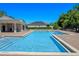 Community pool with brick surround, bath house and lounge chairs, perfect for hot days at 1918 Marabou Dr, Davenport, FL 33896