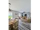 Open concept living and dining area with modern furnishings and plenty of natural light at 2131 Nicollett Way, Leesburg, FL 34748