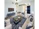 Inviting living room featuring stylish furniture, modern lighting, and a trendy blue accent rug at 2131 Nicollett Way, Leesburg, FL 34748