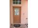 View of the front door with a glass window in the middle at 220 Abbotsbury Dr, Kissimmee, FL 34758