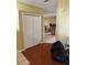 Hallway with closet space and views into the kitchen and living room at 220 Abbotsbury Dr, Kissimmee, FL 34758