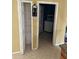 Small pantry and laundry room located off the kitchen at 220 Abbotsbury Dr, Kissimmee, FL 34758