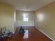 Open concept living room with decorative flooring and a chandelier at 220 Abbotsbury Dr, Kissimmee, FL 34758