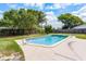 Backyard pool with diving board, patio, privacy fence, and luscious landscaping at 2311 Huron Trl, Maitland, FL 32751