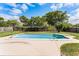 Backyard pool with diving board, patio, privacy fence, and luscious landscaping at 2311 Huron Trl, Maitland, FL 32751