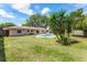 A backyard featuring a swimming pool and patio area with lush landscaping at 2311 Huron Trl, Maitland, FL 32751