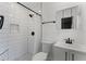 Modern bathroom featuring subway tile shower, black hardware, and stylish vanity at 2311 Huron Trl, Maitland, FL 32751