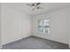 A bedroom featuring a ceiling fan, window, and closet space at 2311 Huron Trl, Maitland, FL 32751