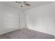 A bright bedroom featuring a ceiling fan and carpet at 2311 Huron Trl, Maitland, FL 32751