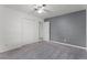 The bedroom boasts two closets, carpet, and a modern accent wall at 2311 Huron Trl, Maitland, FL 32751