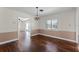 Light-filled dining room with hardwood floors, decorative chandelier, and views to other living areas at 2311 Huron Trl, Maitland, FL 32751