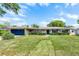 Charming home with well manicured lawn and driveway leading to the garage at 2311 Huron Trl, Maitland, FL 32751