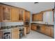 Modern kitchen showcasing custom cabinetry, granite countertops, stainless steel appliances, and breakfast bar at 2311 Huron Trl, Maitland, FL 32751