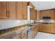 Updated kitchen featuring custom cabinetry, granite countertops, and stainless steel appliances at 2311 Huron Trl, Maitland, FL 32751