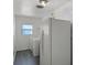 Bright laundry room with appliances including a washer, dryer, and refrigerator at 2311 Huron Trl, Maitland, FL 32751