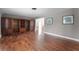 Spacious living room with hardwood floors and a built-in bookcase at 2311 Huron Trl, Maitland, FL 32751
