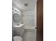 Clean bathroom featuring a shower-tub combo, modern vanity, and tiled floors at 2322 Vincent Rd, Orlando, FL 32817