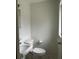 Powder bathroom featuring a toilet, sink, and window at 2322 Vincent Rd, Orlando, FL 32817