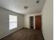 Bright bedroom featuring a window, carpet flooring, and closet for ample storage at 2322 Vincent Rd, Orlando, FL 32817
