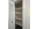 View of closet with shelves behind louvered doors at 2322 Vincent Rd, Orlando, FL 32817