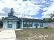 Charming single-story home with a light blue exterior and well-maintained lawn at 2322 Vincent Rd, Orlando, FL 32817