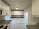 Efficient kitchen featuring white cabinets and practical countertop space at 2322 Vincent Rd, Orlando, FL 32817