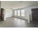Spacious living room filled with natural light, featuring modern flooring at 2322 Vincent Rd, Orlando, FL 32817