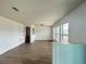 Open-concept living room with a view into other rooms and modern flooring at 2322 Vincent Rd, Orlando, FL 32817