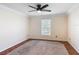 Large bedroom with hardwood floors, a ceiling fan, neutral walls, and natural light at 241 Churchill Ct, Kissimmee, FL 34758