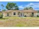 Charming single-story home with a well-maintained lawn, showcasing a cozy and inviting curb appeal at 241 Churchill Ct, Kissimmee, FL 34758