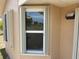 Accordion style hurricane shutters open on the exterior of the home at 241 Churchill Ct, Kissimmee, FL 34758