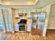 Well-lit kitchen featuring stainless steel appliances, granite countertops, and stylish backsplash at 241 Churchill Ct, Kissimmee, FL 34758