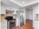 Contemporary kitchen with stainless steel appliances, and a light-filled skylight at 241 Churchill Ct, Kissimmee, FL 34758