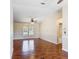 Living room featuring attractive flooring, ceiling fan, and natural light at 241 Churchill Ct, Kissimmee, FL 34758