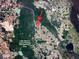 An aerial view showing the proximity to the neighborhood and the surrounding area at 241 Churchill Ct, Kissimmee, FL 34758