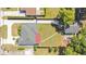 An overhead shot of the home with a lush green lawn and a detached garage at 2812 E Michigan St, Orlando, FL 32806