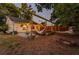 Backyard with cozy seating, hammock, a firepit, and string lights for evening relaxation at 2812 E Michigan St, Orlando, FL 32806