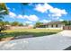 Large backyard featuring a well-maintained lawn, mature trees, and fence for privacy at 2812 E Michigan St, Orlando, FL 32806