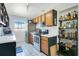 Kitchen with stainless steel appliances and open shelving with dark lower cabinets at 2812 E Michigan St, Orlando, FL 32806