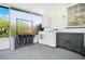 Well-lit laundry area with modern appliances, cabinetry, and view from the window at 2812 E Michigan St, Orlando, FL 32806