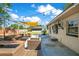 The patio offers outdoor seating, string lights, and a sunshade for relaxing outdoors at 2812 E Michigan St, Orlando, FL 32806