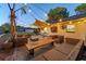 Relaxing patio features outdoor furniture, string lights, and shade for outdoor lounging at 2812 E Michigan St, Orlando, FL 32806