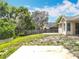 Spacious backyard featuring partial fencing and view of the house at 2850 Tremont Dr, Eustis, FL 32726