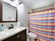 Bathroom featuring a vanity and shower with colorful curtain at 2850 Tremont Dr, Eustis, FL 32726