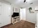 Neutral bedroom featuring a bookshelf with books and decor at 2850 Tremont Dr, Eustis, FL 32726