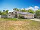 Charming single-story home featuring a two-car garage, landscaped yard, and neutral exterior paint at 2850 Tremont Dr, Eustis, FL 32726