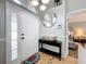 Bright entryway featuring tile flooring, a decorative mirror, and neutral wall paint at 2850 Tremont Dr, Eustis, FL 32726